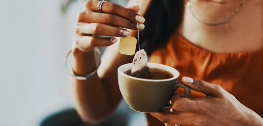 woman holding a cup of tea