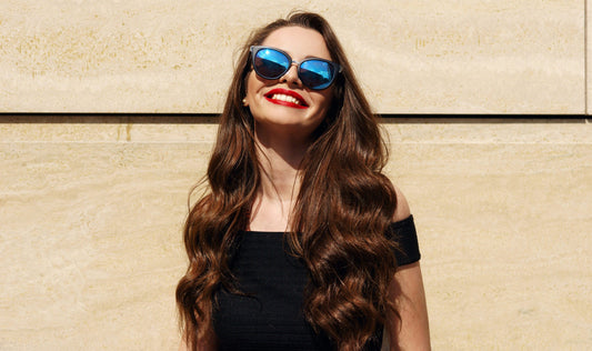 woman smiling sporting a wavy textured hair