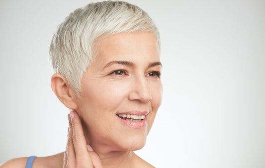 older women with a short hairstyle smiling