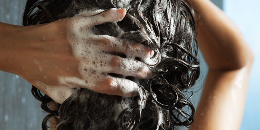 back view of a person washing their hair